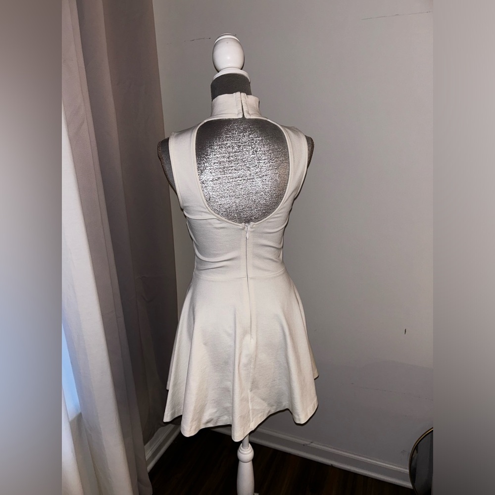 NastyGal crème halter peplum dress. Short